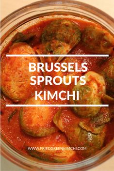 brussels sprouts in a red sauce with the words brussel sprouts kimchi above it