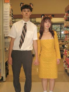 a man and woman are dressed up in costumes