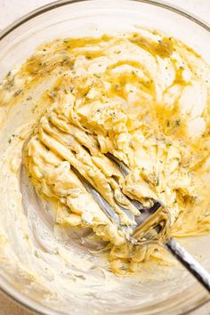 a mixing bowl filled with mashed potatoes and cream