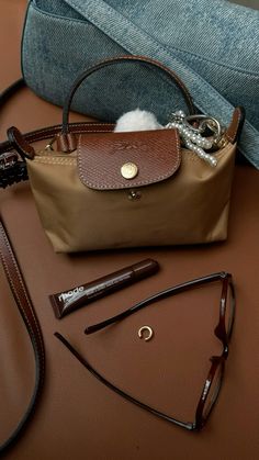 #longchamp #longchamp mini Longchamp Pouch Aesthetic, Longchamp Medium Le Pliage Outfit, Long Champ Le Pliage Mini, Long Champ Mini Bag Outfit, Long Champ Aesthetic, Long Champ Bag Mini, Long Champ Mini Bag, Long Champ Le Pliage Outfits, Long Champ Bag Aesthetic