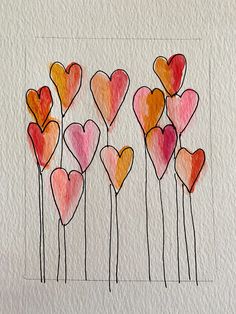 an art project with watercolors on paper and colored pencils in the shape of hearts