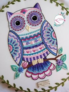 an owl is sitting on a branch with leaves and flowers around it, painted in bright colors