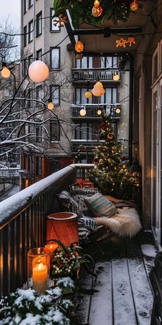 a balcony decorated for christmas with lights and decorations on the outside, including a small tree