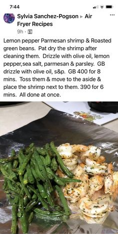 some green beans and other food on tin foil with the caption's description