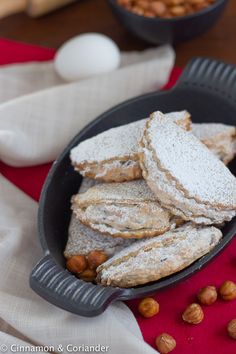 some cookies and nuts in a pan on a table