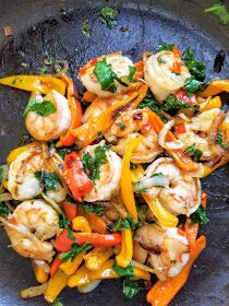 shrimp, bell pepper and carrot stir fry in a skillet