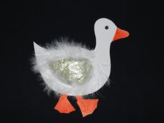 a white duck with orange feet on a black background