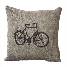 a decorative pillow with a bicycle on the front and back, made from grey flannel fabric