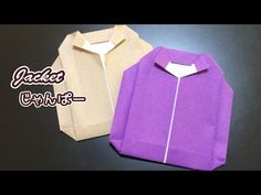 an origami jacket with zippers on the front and back, sitting next to each other