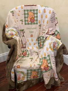 a winnie the pooh chair covered with a blanket