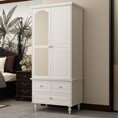 a bedroom scene with focus on the armoire and bed