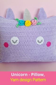 a crocheted unicorn pillow with flowers on it and the words,'anleiting