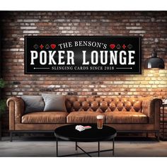 a living room with a couch, table and chair in it that says the benson's poker lounge