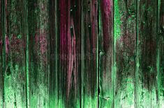 an abstract background with green and pink paint