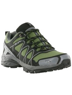 a pair of hiking shoes with green and grey accents on the upper part of the shoe