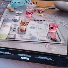 the game night is set up with glasses and confetti