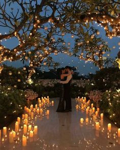 an instagram photo with candles in the background and a couple hugging each other on their wedding day