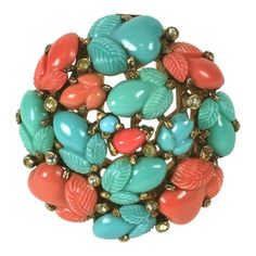 Trifari, Alfred Philippe round dome clip brooch of pink gold plated base metal, crystal rhinestones and faux coral, jade and turquoise fruit salad stones. This was produced as a pin with pastel coral fruit salads, signed KTF, before the change of marks in late 1937, suggesting a date for this of 1938. Excellent Condition. 1.65" x 1.65" Marked: Trifari with Crown Coral Jewelry Vintage, Vintage Rhinestone Jewelry, Fruit Salads, Vintage Designer Jewelry, Trifari Jewelry, Cameo Jewelry, Crown Trifari, Vintage Jewelry Box, Coral Jewelry