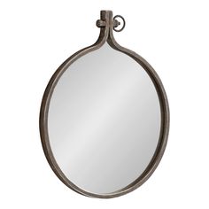 a round mirror hanging from the side of a metal wall mounted hook on a white background