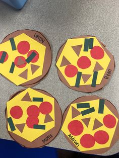 four pieces of paper cut out to look like pizzas