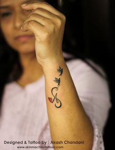 a woman with a tattoo on her arm