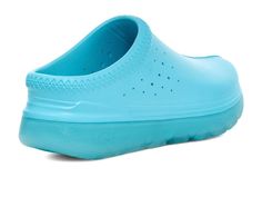 A perfect combination of comfort and casual style, the UGG® Tasman Sport Clogs are a must-have!.EVA upper, lining, and footbed..Slip-on style..Lightweight and perforated design for added breathability..Open back silhouette..Round toe design..TPE outsole..Imported..Product measurements were taken using size Men's 3, Women's 4.5, width Medium. Please note that measurements may vary by size..Measurements: Heel Height: 2 in Weight: 8.7 oz Casual Blue Clogs With Arch Support, Waterproof Ergonomic Casual Clogs, Comfortable Waterproof Slip-on Clogs, Waterproof Comfortable Slip-on Clogs, Casual Waterproof Slip-on Clogs, Waterproof Slip-on Casual Clogs, Casual Slip-ons With Slip-resistant And Ergonomic Features, Casual Ergonomic Clogs For Outdoor, Ugg Shoes Women