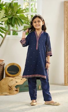 2-Piece Embroidered Suit for Girls (shirt & trouser only). Description Kameez (Shirt) : Crafted on a solid palette with exquisite embroidery details on shirt Shalwar (Trouser) : Plain straight raw-silk pants. Fabric : Paper cotton. General Care Instruction : Should be hand washed and hung to dry. Color may bleed so please be mindful of other items with it. General Disclaimer    -- Size chart provides reference sizes and actual sizes might be slightly different from the size chart.    -- Actual colors of the outfit may vary from the colors being displayed on the screen Blue Anarkali Lawn Suit With Embroidered Border, Festive Blue Lawn Suit With Embroidered Border, Chikankari Embroidery Sets For Eid, Embroidered Blue Pant Set For Diwali, Blue Embroidered Pant Set For Diwali, Blue Embroidered Long Sleeve Pant Set, Navy Blue Girls Dress, Embroidered Suit, Shirt Trouser