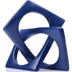 a blue sculpture sitting on top of a white table