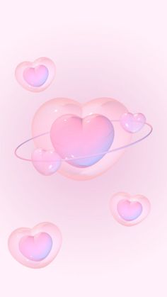 a pink heart floating in the air surrounded by bubbles