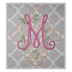 the monogrammed letter m is shown in pink and green on a gray background