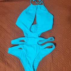 I Bought This Swimsuit Because I Loved The Color! Unfortunately, It Just Didn't Look Great On Me So I Never Wore It. Might Look Amazing On You Though! Blue Stretch One-piece For Party, Blue Halter Neck One Piece For Pool, Blue Halter Neck One-piece For Pool, Blue Halter Neck Bodysuit For Party, Blue Stretch Cutout Swimwear, Blue Summer Bodysuit For Beach Party, Blue Backless One Piece With Lined Body, Summer Style Blue Bodysuit For Beach Party, Blue Summer Halter Neck One-piece