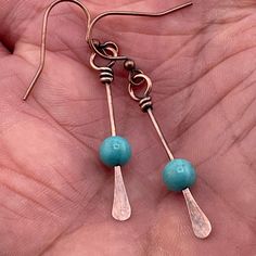 "Welcome to our Bohemian Handmade Copper and Blue Turquoise Dangle Earrings, perfect for adding a touch of free-spirited charm to any outfit. These earrings are not just accessories; they're expressions of individuality and style, making them an ideal gift for girlfriends, sisters, or anyone who loves boho summer festival jewelry. Each earring is meticulously crafted with care and attention to detail, featuring genuine blue turquoise stones set in beautiful copper accents. The combination of these earthy elements creates a mesmerizing contrast that captures the essence of bohemian aesthetics. These dangle earrings are lightweight and comfortable to wear, making them suitable for all-day wear during summer festivals or casual outings. They also make a thoughtful minimalist gift for her, sym Boho Handmade Jewelry, Copper Earrings Handmade Ideas, How To Make Wire Earrings, Jewelry Making Ideas Earrings, Boho Earrings Hippie Bohemian, Wire Bead Jewelry, Diy Boho Jewelry, Diy Earrings Dangle, Copper Earrings Handmade