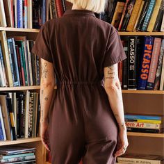 Noble Carriage's signature Utility Suit is finally available for adults to make all of your twinning jumpsuit dreams come true. Made in Peru with their durable yet buttery soft GOTS certified organic Pima cotton canvas in a brown Chocolate shade and featuring a cropped leg and cinched waist. Made in Peru Casual Brown Cotton Jumpsuits And Rompers, Brown Cotton Jumpsuits And Rompers For Work, Brown Relaxed Fit Overall Jumpsuit, Brown Relaxed Fit Jumpsuit Overall, Brown Loungewear Jumpsuits With Pockets, Brown Relaxed Fit Jumpsuit, Brown Relaxed Fit Overalls, Brown Cotton Relaxed Fit Jumpsuits And Rompers, Brown Short Sleeve Jumpsuits For Work