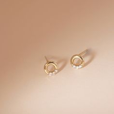 Want in on the minimalist earring trend, but upgraded with diamonds? We have just what you need with our Open Circle Diamond Studs - chic and simple and studded with six little diamonds. Product Details: Material: 14K Solid Yellow Gold Outer Diameter: 5.0mm Thickness: 1.2mm Total Carat Weight: 0.03carat Sold as a pair Minimalist Round Cut Diamond Earrings With Accents, Minimalist Diamond Accented Wedding Earrings, Minimalist Diamond Wedding Earrings With Accents, Minimalist Everyday Diamond Earrings With Accents, Minimalist Brilliant Cut Diamond Earrings, Everyday Minimalist Diamond Earrings With Accents, Minimalist Single Cut Diamond Earrings For Everyday, Minimalist Diamond Earrings With Single Cut Diamonds, Minimalist Everyday Earrings With Single Cut Diamonds