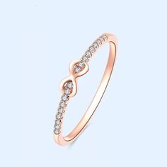 "So elegant is this infinity style diamond ring, perfect for everyday wear as the diamond gives just the right amount of sparkles to your finger. Absolutely perfect for any occasion and stacks well with other ring styles. Ring features: Metal: Available in solid white, yellow, or rose gold 14k. - Ring Width: Approximately 1.3 mm - Diamond Shape: Round - Number of Stones: 18 of Mined Diamond (100% Real Diamonds ) - Diamond Size: 1.1 mm - Total CTW: 0.08 Ctw - Diamond Color-Clarity: G - H Color SI Classic Infinity Diamond Promise Ring, Elegant Infinity Rings For Anniversary, Elegant Infinity Stackable Rings, Infinity Ring For Anniversary, White Gold Infinity Diamond Promise Ring, Elegant Infinity Promise Ring, Infinity Diamond Stackable Rings For Anniversary, Infinity Diamond Stackable Anniversary Rings, Rose Gold Infinity Stackable Wedding Rings