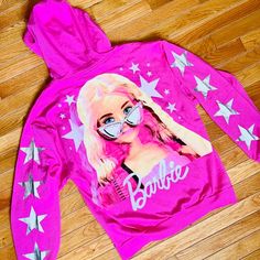 New Very Unique Nwt Barbie Double Sided Zip Up Hoodie With Star On The Arms. It’s The Same Color As The Famous Western Cowgirl Outfit From The Barbie Movie With Silver Stars On The Arms, Signature Barbie Logo On The Front With Zip Up Hood And Large Barbie And Starts On The Back. So Cute And Very Rare I Only Have 2! One Size Medium And One Size Large. Don’t Miss Out This Isn’t Gonna Last Long! Western Cowgirl Outfits, Barbie Crop Top, Barbie Sweatshirt, My Little Pony Cake, Little Pony Cake, Pony Cake, Barbie Top, The Barbie Movie, Barbie Logo