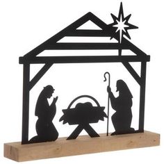 a metal nativity scene with the birth of jesus