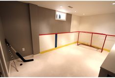 an empty room with a hockey goal in it