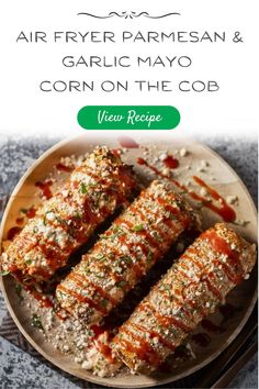 an image of food on a plate with the words air fryer parmesan and garlic mayo corn on the cob