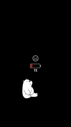 a polar bear sitting in the dark with a red light on it's head