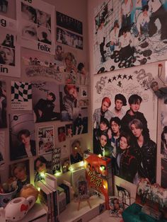 a room with many pictures and lights on the wall, including one person's head