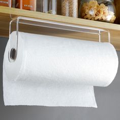 a roll of toilet paper hanging from a shelf