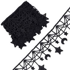 two pieces of black lace with stars and crescents on them, one is cut in half