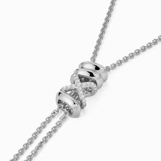 This Iconic X Lariat Necklace invites you to uncover your inner treasures through its bold and iconic design, making a definitive statement of discovery and self-expression. Accent diamonds: 0.05+ ctw, VS2+/F+ Setting: Prongs setting Pendant dimensions: 72 x 6 mm approx. Chain Type: Ovale Trace Closure: Lobster clasp Luxury Sterling Silver Lariat Jewelry, White Gold Lariat Necklace, Luxury Lariat Sterling Silver Necklace, Fine Jewelry White Gold Pendant Lariat Necklace, Luxury Sterling Silver Lariat Necklace, White Gold Pendant Lariat Necklace, Luxury White Gold Lariat Jewelry, Luxury Lariat Jewelry For Anniversary, Modern White Gold Lariat Necklace