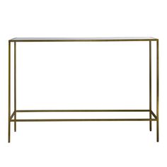 an iron and glass console table with gold legs, against a white background or backdrop