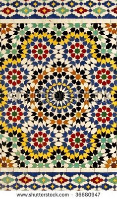 an intricately designed tile in the form of a flower pattern, with many colors and shapes