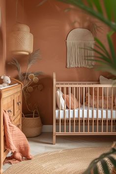 a baby's room with a crib, dresser and potted plant