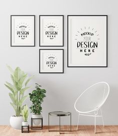 three black and white posters hanging on the wall next to a chair, table and potted plant