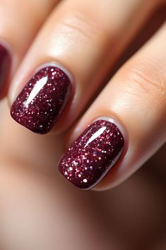 a woman's hand with red glitter on it