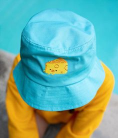 MR CHEESE BUCKET HAT Embroidered MR CHEESE logo on teal bucket hat.Bucket hat is unstructured.One size fits most.Wider lip provides more shade. Mr Cheese, Cheese Logo, Apparel Brand, Bucket Hat